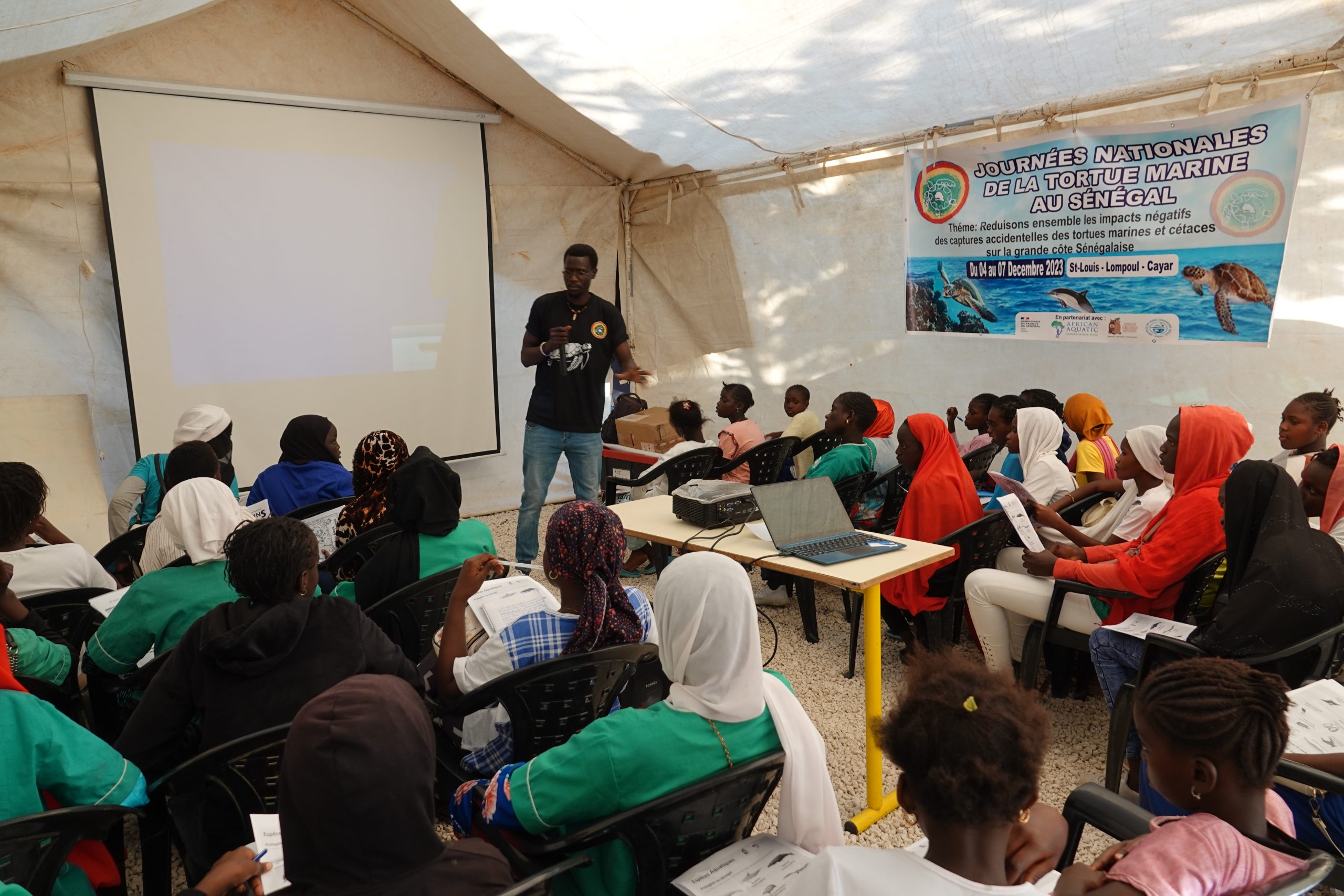 Teaching local community members about turtles and tortoises.
